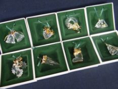 EIGHT BOXED SWAROVSKI CRYSTAL 'CHRISTMAS MEMORIES' TREE ORNAMENTS