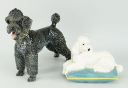 BESWICK POTTERY MODEL OF A RECLINING POODLE ON A CUSHION and a Rosenthal porcelain poodle No.1163