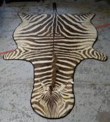 VINTAGE ZEBRA SKIN RUG, approximately 243 x 162cms