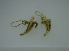 PAIR OF 750 MARKED YELLOW METAL DROP EARRINGS in the form of Janbiya dagger and scabbards, 8.6gms