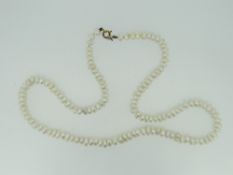 STRING OF NATURAL PEARLS WITH YELLOW METAL CLASP IN BOX.