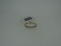 SEVEN STONE DIAMOND RING set in 9ct yellow gold, with gem certificate in box, 2.2gms