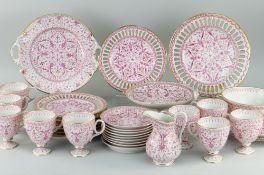 FISCHER & MIEG PORCELAIN PART TEA SET, approximately 32 pieces, plates with ribbon borders, pink