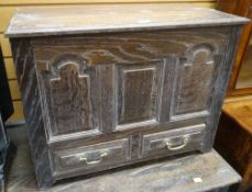 GOOD 20TH CENTURY OAK COFFER BACH carved with three panels and with two lower drawers, 68cms wide