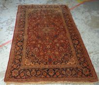 MAINLY RED & BLUE GROUND PERSIAN WOOLEN RUG with centre medallion decoration and with a border, mai