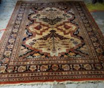 MAINLY BROWN & BLUE GROUND WOOLEN SAMARKAND RUG with pattern border and mirrored flower decoration