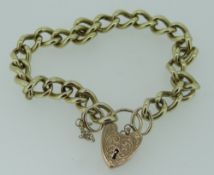 9CT YELLOW GOLD CURB LINK BRACELET WITH HEART SHAPED PADLOCK, 30.6gms, 21cms long.