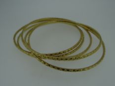 FIVE YELLOW METAL INDIAN DOWRY LADIES BANGLES (tested as high carat approximately 22ct gold), 57