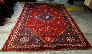WOOLEN PERSIAN SHIRAZ RUG in mainly red and blue ground with geometric pattern and contrasting