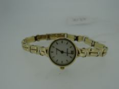 LADIES 9CT YELLOW GOLD BRACELET WATCH by Accurist with white circular dial (spare link) 13gms