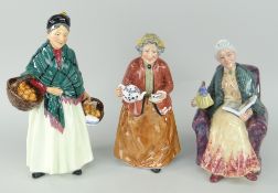 THREE ROYAL DOULTON BONE CHINA FIGURINES to include 'The Orange Lady' HN1953, 'Prized Possessions'