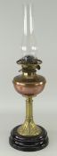 ANTIQUE OIL LAMP WITH ART NOUVEAU STYLE BRASS STEM, circular black glass base, copper reservoir