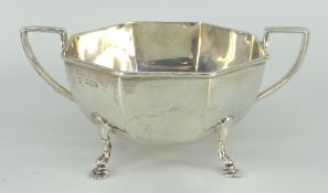 SILVER TWIN-HANDLED SUGAR BASIN of faceted form on hoof feet, London 1918, 8.1ozs