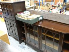 REPRODUCTION TWO DOOR GLAZED BOOKCASE with flanking open shelves in mahogany, and a linen fold