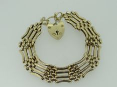 9CT YELLOW GOLD FOUR BAR GATE BRACELET WITH HEART SHAPED PADLOCK, 29.1gms, 20cms long.