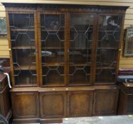 REPRODUCTION BREAK-FRONT BOOKCASE CUPBOARD with carved frieze, 201cms wide