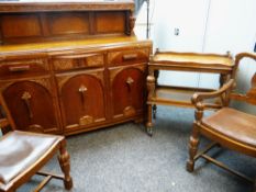 VINTAGE CARVED DINING SUITE OF TEA TROLLEY, DINING TABLE AND CHAIRS AND SIDEBOARD, the table of draw