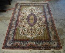 GOOD FINE WOOL PERSIAN RUG with bird and flower centre decoration and red and blue ground border,