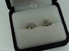 PAIR OF YELLOW METAL DIAMOND EARRINGS with gem specification card