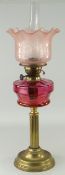 ANTIQUE CORINTHIAN COLUMN BRASS BASED OIL LAMP, cranberry glass reservoir, pink tinted etched