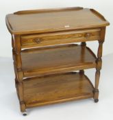 ERCOL THREE TIER TEA TROLLEY on casters, cutlery drawer and gallery top, 78cms wide