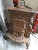 ORNATE ANTIQUE CAST IRON STOVE
