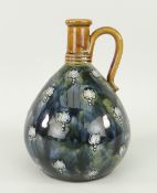 ROYAL DOULTON STONEWARE GLOBULAR LOOP HANDLED VASE decorated with tube lined floral design,