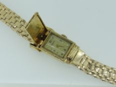 VINTAGE YELLOW GOLD 'KINGSTON' LADIES WRISTWATCH marked 14k, with flip case cover, 40.9gms