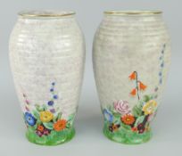 PAIR OF CROWN DEVON FLORAL & RIBBED BALUSTER VASES, 19cms high