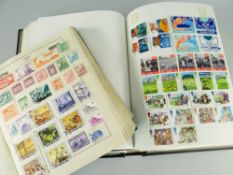 GREEN VINTAGE STRAND STAMP ALBUM & LATER BLACK INTERNATIONAL STAMP ALBUM, green album