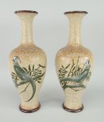 PAIR OF DOULTON LAMBETH BALUSTER VASES decorated with exotic birds, printed and inside marks to