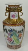 CHINESE STYLE FLOOR-STANDING BALUSTER VASE gilded with twin stork handles and floral panels, 93cms