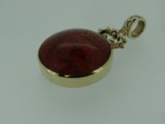 9CT YELLOW GOLD SET BLOODSTONE & MOTHER-OF-PEARL PENDANT of circular form with scroll to a loop