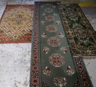 LARGE MAINLY RED & BLUE GROUND PERSIAN STYLE WOOLEN RUG with centre medallion and border, 370 x