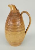 DOULTON LAMBETH EARTHENWARE LOOP HANDLED JUG of geometric banded design, impressed mark to base