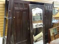 VINTAGE LINEN-FOLD BREAK FRONT WARDROBE, centre mirrored-door opening to linen drawers, flanking