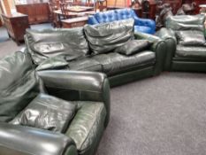 GOOD GREEN LEATHER THREE PIECE SUITE of large proportions and with four matching loose cushions