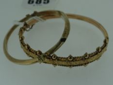 TWO 9CT YELLOW GOLD SCROLL ENGRAVED BANGLES, 12.4gms overall approximately (2)
