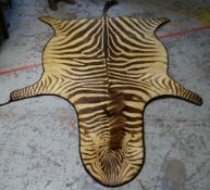 VINTAGE ZEBRA SKIN RUG, approximately 234cms long x 165cms wide