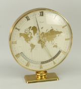 MID-CENTURY KIENZLE TABLE WORLD CLOCK with various country time-zones, raised on a pedestal and with