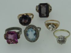 SIX YELLOW AND WHITE METAL SEMI-PRECIOUS STONE SET DRESS RINGS including 9ct gold. (6)