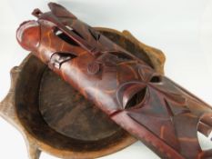 LARGE WOODEN CHAPATI BOWL, 61cms diameter, together with a large wooden tribal mask