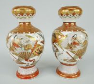 PAIR OF KUTANI GOURD SHAPED VASES decorated with fans, figures in a group ETC, signed, 17cms high