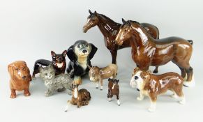 ASSORTED CERAMIC DOMESTIC ANIMAL SCULPTURES including two standing Beswick brown horses, Sylvac