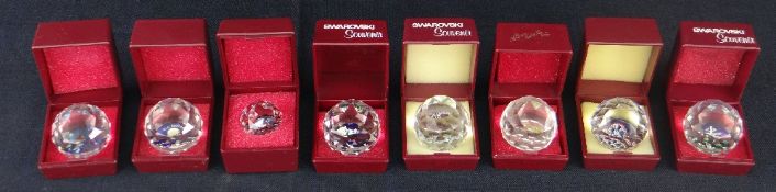 EIGHT CASED SWAROVSKI CRYSTAL SOUVENIR PAPERWEIGHTS