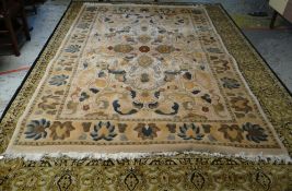 MAINLY GREEN & GOLD GROUND PERSIAN RUG with centre decoration and contrasting border, 341 x