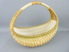ROYAL WORCESTER - substantial boat shaped woven basket with single split-end handle, 1906, 25cms