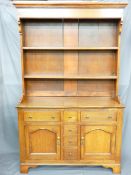 A LATE 19TH CENTURY OAK DRESSER of neat proportions, having a two-shelf rack over a T arrangement of