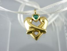 18CT GOLD 'HUG' PENDANT with heart shaped emerald by 'Boodles', 8grms