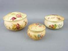ROYAL WORCESTER - three blush floral lidded powder bowls of graduated size, 1912 and 1906, the